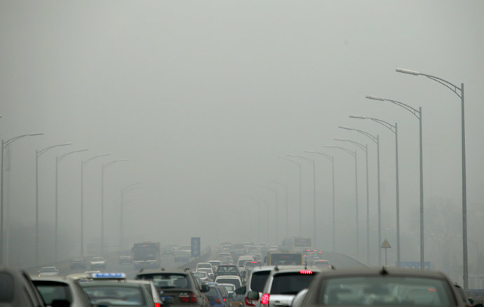Cars travel on an overpass amid thick haze in the morning in Beijing February 26, 2014. (Reuters/Kim Kyung-Hoon)