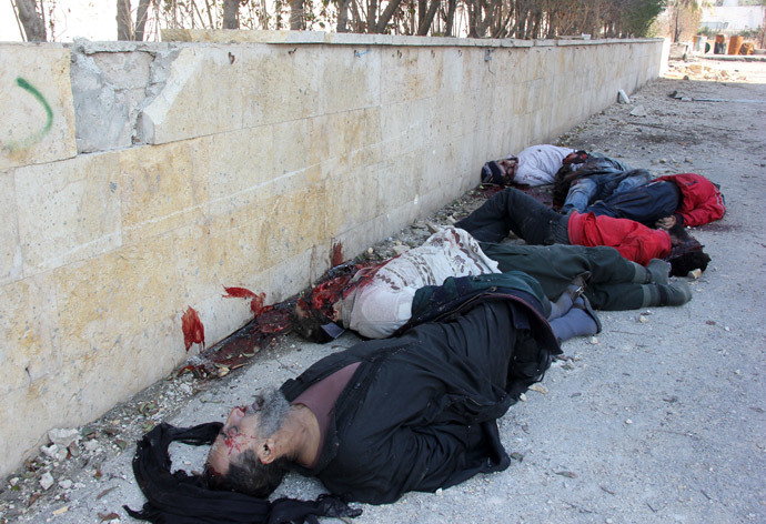 Bodies of handcuffed and blindfolded dead men lie on the ground of the Aleppo headquarters of the Islamic State of Iraq and the Levant (ISIL) after they were allegedly executed by the al-Qaeda-linked group, in the northern city of Aleppo (AFP Photo / Zakariya Al-Kafi) 