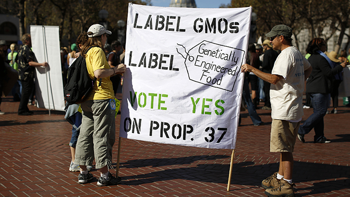 Two demonstrators hold a sign during a rally in support of the initiative, commonly known as the California Right to Know Genetically Engineered Food Act in San Francisco, California October 6, 2012. (Reuters / Stephen Lam)