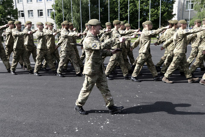 Britain's army soldiers march during opening ceremony of NATO military exercise "Saber Strike" in Adazi June 9, 2014. (Reuters/Ints Kalnins)