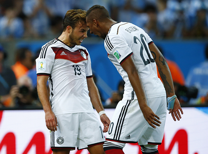 Germany's Mario Goetze (L) celebrates with teammate Jerome Boateng after scoring against Argentina during extra time in their 2014 World Cup final at the Maracana stadium in Rio de Janeiro July 13, 2014. (Reuters / Sergio Moraes)