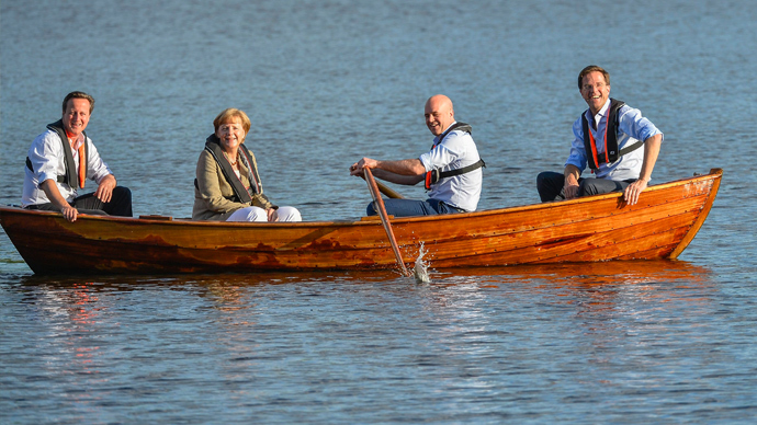 (L-R) British Prime Minister David Cameron, German Chancellor Angela Merkel, Swedish Prime Minister Fredrik Reinfeldt and Dutch Prime Minister Mark Rutte sit in a punt with Reinfeldt handling the oars in a lake at Reinfeldt's summer residence Harpsund, southwest of Stockholm June 9, 2014, during an evening break in their talks on EU and the new European Parliament (Reuters / Anders Wiklund)