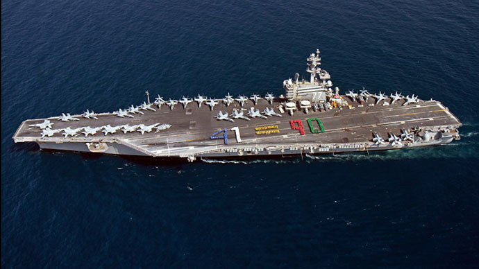 A handout picture released by the US Navy shows aircraft carrier USS George H.W. Bush (CVN 77) sailing in the Arabian Sea on June 13, 2014. (AFP Photo)