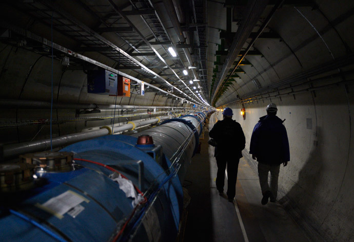CERN staff walk in the LHC (Large Hadron Collider) tunnel during a visit at the Organization for Nuclear Research (CERN) in Meyrin, near Geneva (Reuters / Denis Balibouse) 
