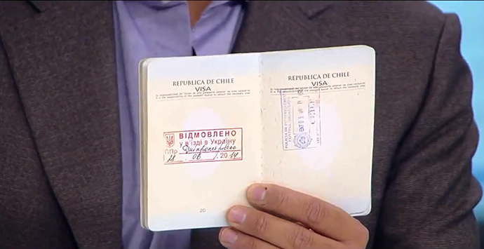 Mauricio Ampuero's passport (Screenshot from RT Spanish video)