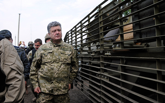 Ukraine's President Petro Poroshenko walks at the military camp near the town of Svyatogorsk in Eastern Ukraine, June 20, 2014 (Reuters / Stringer)