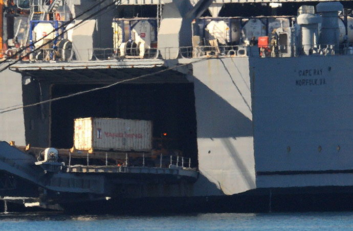 Containers of Syrian chemical weapons from a Danish freighter are transferred to a US military ship ahead of their destruction at sea on July 2, 2014 in the port of Gioia Tauro, southern Italy. (AFP Photo / Mario Laporta)