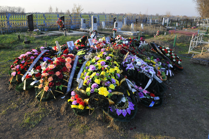 The gravesite of the Ametovs, the host family killed in their home with other two families in the farming village of Kushchevskaya, including the grave of Server Ametov, his wife Galina, daughter-in-law Yelena and granddaughter Amira, at the village's burial ground. (RIA Novosti)