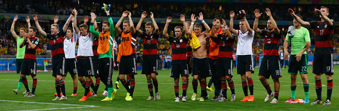 Germany's national soccer players raise their arms in celebration of their win over Brazil at the end of their 2014 World Cup semi-finals at the Mineirao stadium in Belo Horizonte July 8, 2014.(Reuters / Damir Sagolj)