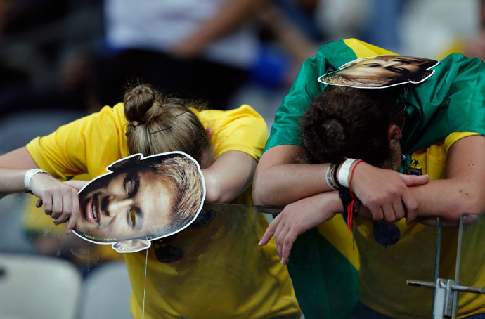 Fans of Brazil react after their loss to Germany in their 2014 World Cup semi-finals at the Mineirao stadium in Belo Horizonte July 8, 2014.(Reuters / Marcos Brindicci)