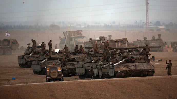Israeli soldiers gather in an army deployment area near Israel's border with the Gaza Strip on July 10, 2014.(AFP Photo / Menahem Kahana )