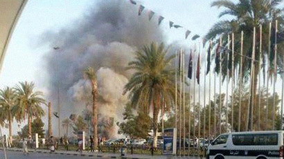 Over 50 dead in Tripoli airport battle as foreigners leave collapsing Libya