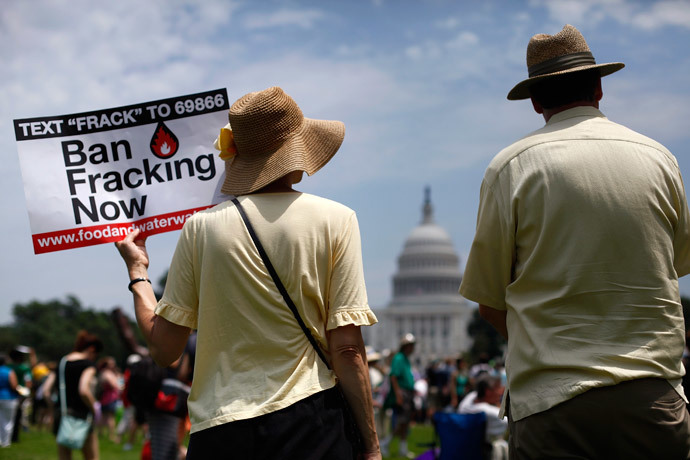 Protesters take part in a rally against U.S. fracked gas exports from the proposed Cove Point facility in Maryland, at a demonstration by several environmental organizations and activists, at the National Mall in Washington July 13, 2014.(Reuters / Jonathan Ernst)