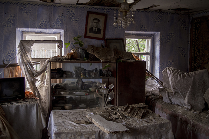 A private house damaged by Ukrainian army's shelling of Lugansk on July 17, 2014. (RIA Novosti / Valeriy Melnikov)