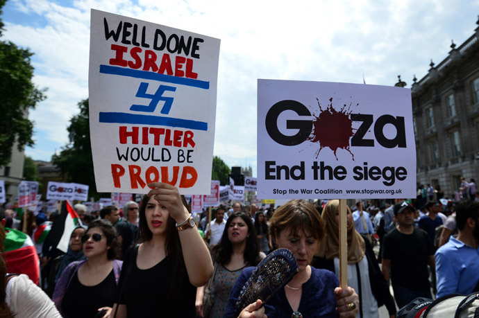 Protesters display placards and banners as they take part in demonstration against Israeli airstrikes in Gaza in central London on July 19, 2014 against Gaza strikes.(AFP Photo / Carl Court)