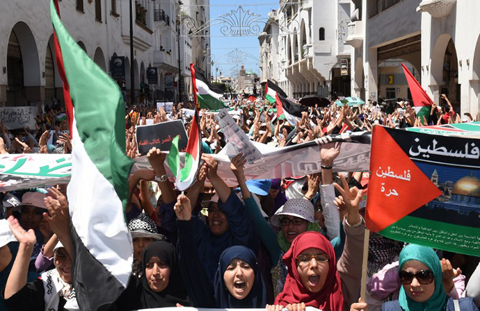 Moroccan protesters shout slogans during a demonstration in support of the Palestinian people and against the ongoing Israeli military offensive in the Gaza Strip, on July 20, 2014, in the capital Rabat. (AFP Photo / Fadel Senna)