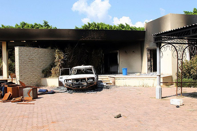 FILE photo. A burnt house and a car are seen inside the US Embassy compound on September 12, 2012 in Benghazi, Libya. (AFP Photo)