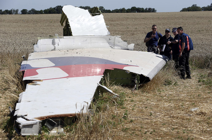 Members of a group of international experts inspect wreckage at the site where the downed Malaysia Airlines flight MH17 crashed, near the village of Hrabove (Grabovo) in Donetsk region, eastern Ukraine August 1, 2014. (Reuters)