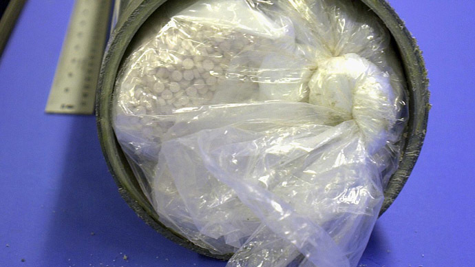 Three ex-Met police officers seized tens of thousands of ecstasy pills from British criminals only to sell the drugs onward on the black market, a leaked Scotland Yard report reveals.(AFP Photo)