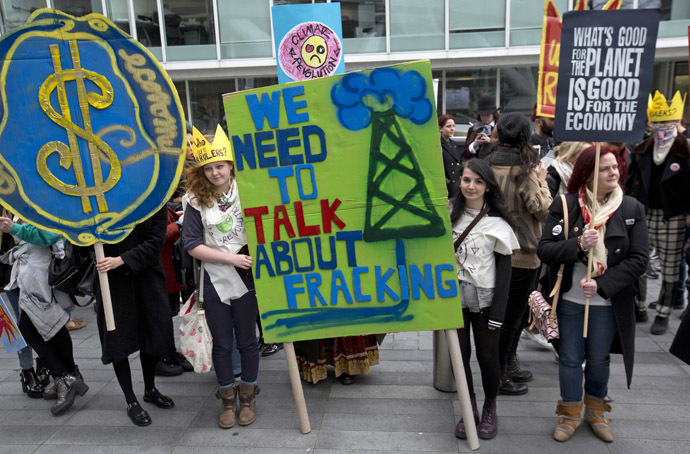 British demonstrators hold banners during an anti-fracking protest in central London on March 19 2014. (Reuters/Neil Hall)