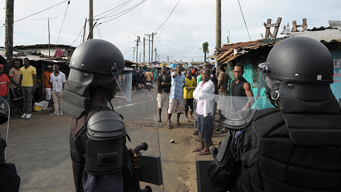 Police open fire, use tear gas on crowds as Liberia struggles to contain deadly Ebola
