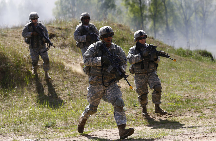Paratroopers from the U.S. Army's 173rd Infantry Brigade Combat Team participate in training exercises with the Polish 6 Airborne Brigade soldiers at the Land Forces Training Centre in Oleszno near Drawsko Pomorskie, north west Poland, May 1, 2014. (Reuters/Kacper Pempel)