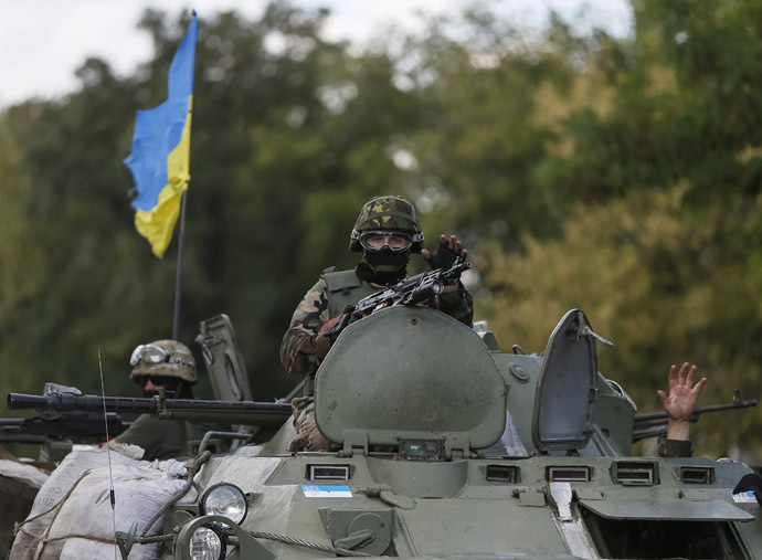 Ukrainian servicemen ride in an armoured vehicle near Debaltseve, Donetsk region, August 29, 2014. (Reuters/Gleb Garanich)