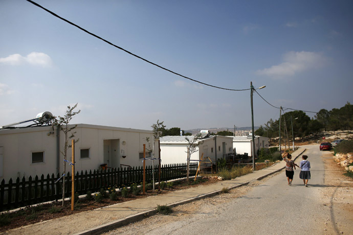 Israeli women walk in a Jewish settlement known as "Gevaot", in the Etzion settlement bloc, near Bethlehem August 31, 2014. (Reuters/Ronen Zvulun)