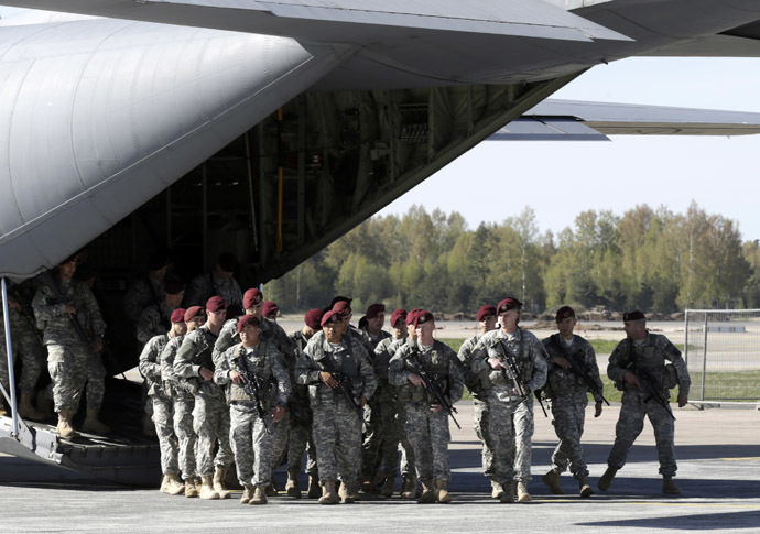 irst company-sized contingent of about 150 U.S. paratroopers from the U.S. Army's 173rd Infantry Brigade Combat Team based in Italy arrive in the airport in Riga April 24, 2014. (Reuters/Ints Kalnins)