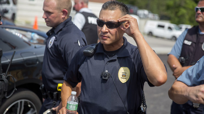 A police officer wears a body camera at a rally for Michael Brown August 30, 2014 in Ferguson, Missouri.(AFP Photo / Aaron P. Bernstein)