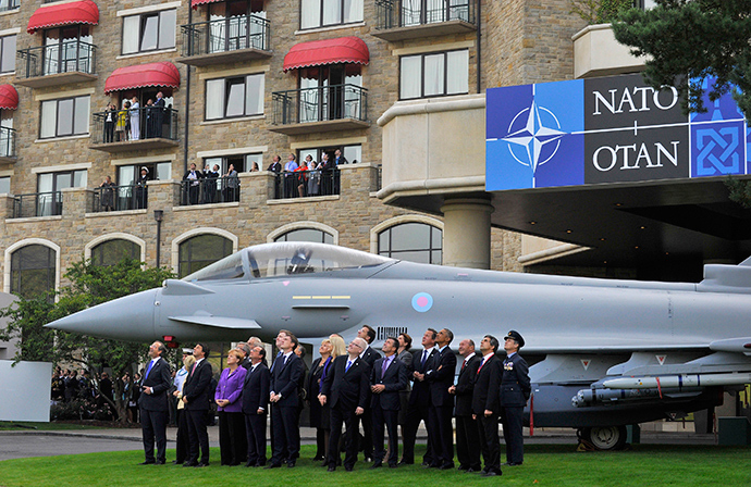 NATO leaders watch a fly-past by the Red Arrows during the NATO summit at the Celtic Manor resort, near Newport, in Wales September 5, 2014 (Reuters / Rebecca Naden)