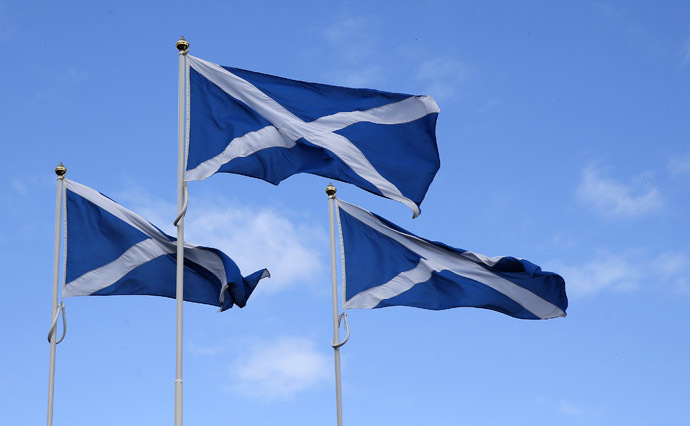 The Flag of Scotland, the Saltire, blows in the wind near Berwick-upon-Tweed on the border between England and Scotland September 7, 2014. (Reuters/Russell Cheyne)