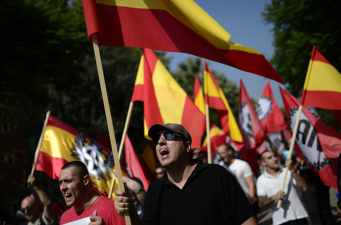 Anti-independence Catalans hold Spanish flags as they take part in a demonstration for the unity of Spain in the centre of Barcelona during Catalonia National Day (Diada) on September 11, 2014. (AFP Photo / Josep Lago)