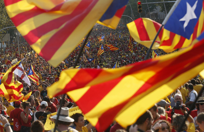People hold "estelada" flags, Catalan separatist flags, during a gathering to mark the Calatalonia day "Diada" in central Barcelona September 11, 2014. (Reuters/Albert Gea)
