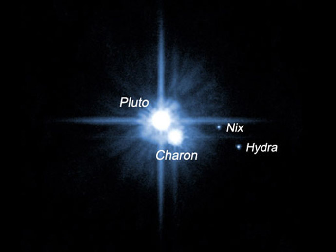A pair of small moons that NASA's Hubble Space Telescope discovered orbiting Pluto now have official names: Nix and Hydra. Photographed by Hubble in 2005, Nix and Hydra are roughly 5,000 times fainter than Pluto and are about two to three times farther from Pluto than its large moon, Charon, which was discovered in 1978. (NASA/ESA)