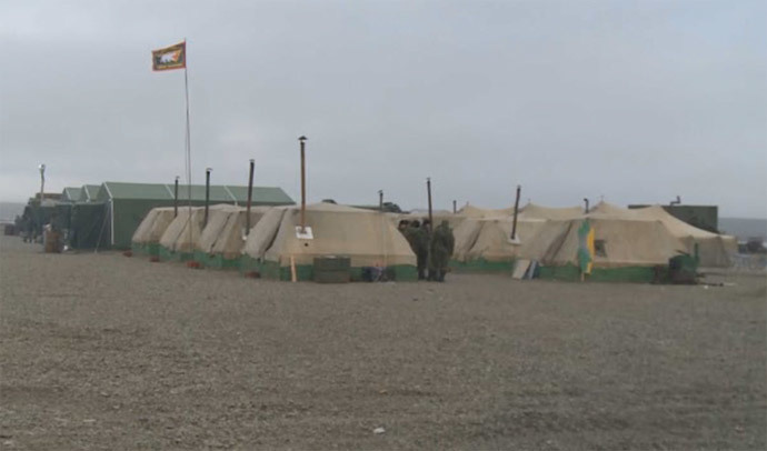 Tents provide temporary housing for the base personnel. Screenshot from RT video