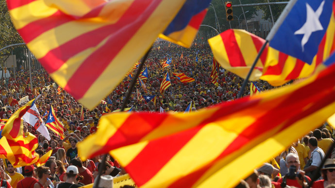 People hold "estelada" flags, Catalan separatist flags, during a gathering to mark the Calatalonia day "Diada" in central Barcelona September 11, 2014. (Reuters / Albert Gea)