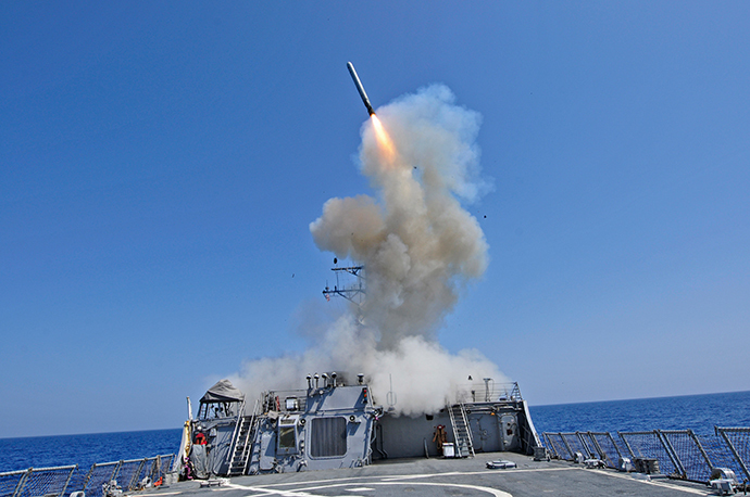 The guided-missile destroyer USS Barry launches a Tomahawk cruise missile from the ship's bow in the Mediterranean Sea in this U.S. Navy handout photo dated March 29, 2011. (Reuters / Jonathan Sunderman / U.S. Navy //Handout)