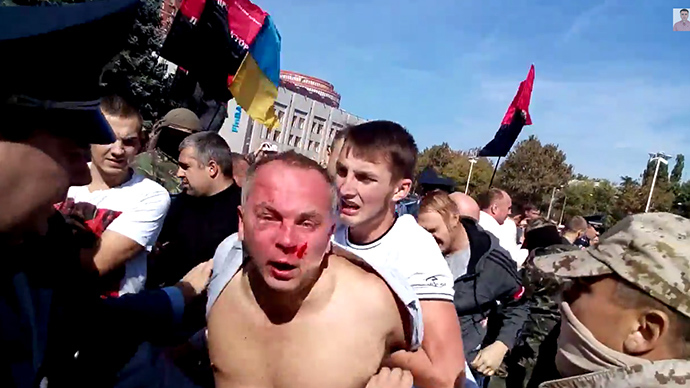 ‘Over my dead body’: Defiant Ukrainian MP beaten by nationalist mob (VIDEO)