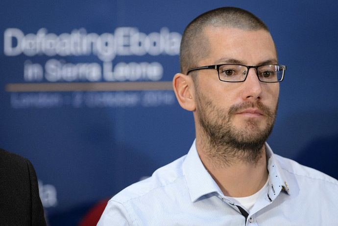British Ebola survivor William Pooley listens to speakers during the "Defeating Ebola: Sierra Leone" conference in central London, on October 2, 2014. (Reuters/Pool/Leon Neal)