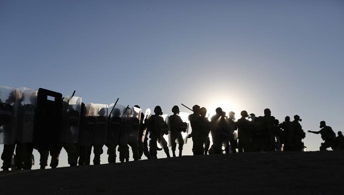 Turkish soldiers take position as they clash with Turkish Kurdish protesters near the Mursitpinar border crossing on the Turkish-Syrian border in the Turkish town of Suruc in southeastern Sanliurfa province October 4, 2014. (Reuters/Murad Sezer)