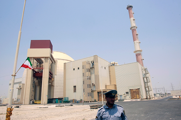 A security official stands in front of the Bushehr nuclear reactor, 1,200 km (746 miles) south of Tehran (Reuters / Raheb Homavandi)