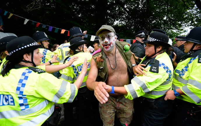 Police scuffle with a demonstrator outside a drill site run by Cuadrilla Resources, near Balcombe in southern England. (Reuters / Paul Hackett)