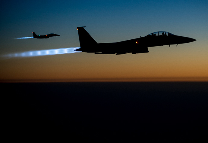 A pair of U.S. Air Force F-15E Strike Eagles fly over northern Iraq after conducting airstrikes in Syria, in this U.S. Air Force handout photo taken early in the morning of September 23, 2014 (Reuters / HO)