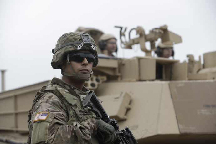 U.S. soldiers deployed in Latvia perform during a drill at Adazi military base October 14, 2014. (Reuters/Ints Kalnins)