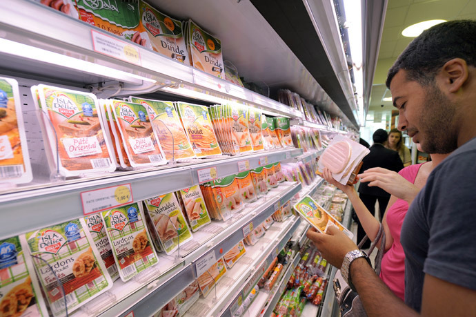 Customers look at food products in a department of a 100% halal food shop, the Hal'Shop, in Nanterre, a western suburb of Paris. (AFP Photo / Miguel Medina)