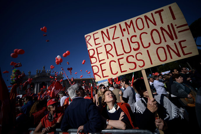 A woman holds a banner reading "Renzi-Monti-Berlusconi = recession" during a demonstration organised by Italian General Confederation of Labour (CGIL) union on October 25, 2014 in central Rome.(AFP Photo / Filippo Monteforte)