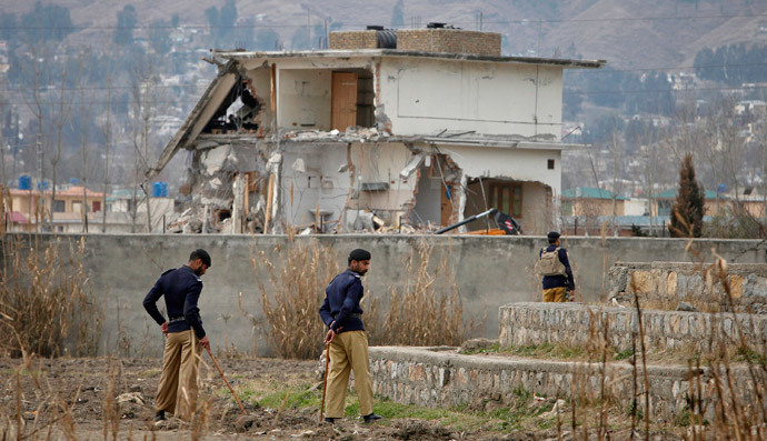 Policemen stand guard near the partially demolished compound where al Qaeda leader Osama bin Laden was killed by U.S. special forces, in Abbottabad February 26, 2012.(Reuters / Faisal Mahmood)
