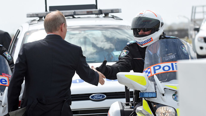 Russiaâs President Vladimir Putin (L) shaking hands with members of his motorcycle escort at the airport in Brisbane as he leaves the G20 Summit.(AFP Photo / Steve Holland)