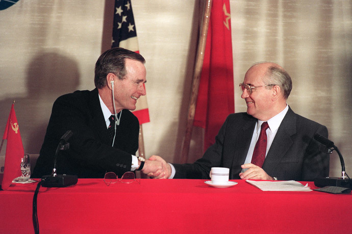 Photo taken 03 December 1989 aboard of the Soviet cruise liner Maxim Gorky of US President George Bush (L) shaking hands with Soviet leader Mikhail Gorbatchev during a joint press-conference after the first US-Soviet summit meeting. This summit is viewed as the official end of the Cold War. (AFP Photo)